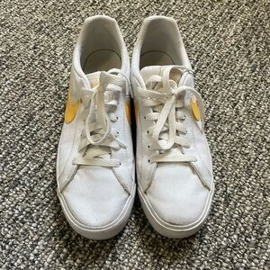 White and Yellow Nike Court